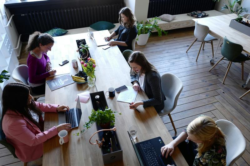Overhead view of a team working together at a shared table